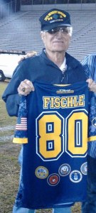 Robert Fischle '44 receiving jersey at Anaheim High Varsity Football Honor Game