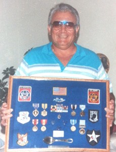 Moreno with a shadow box of duplicate medals presented to him by his family after his originals were stolen.